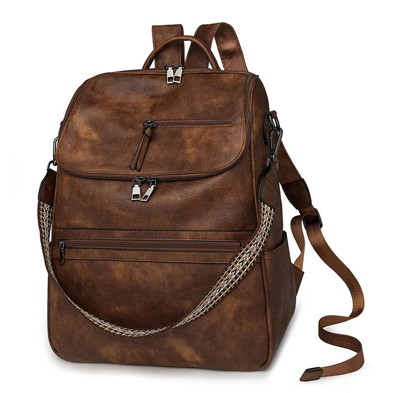 PU leather college backpack with curved shoulder strap in solid colour with stitching detail.