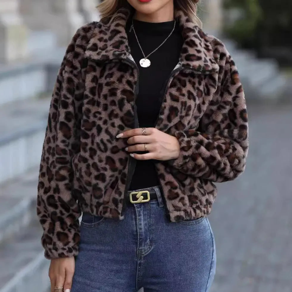 Women's loose fit leopard print plush coat with front zip and raglan sleeves.