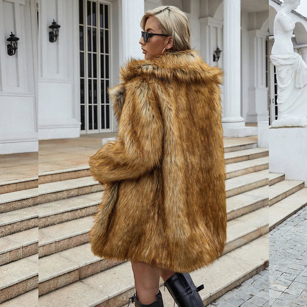 Yellow women's long faux fur coat on a hanger, showing loose fit and regular sleeves.