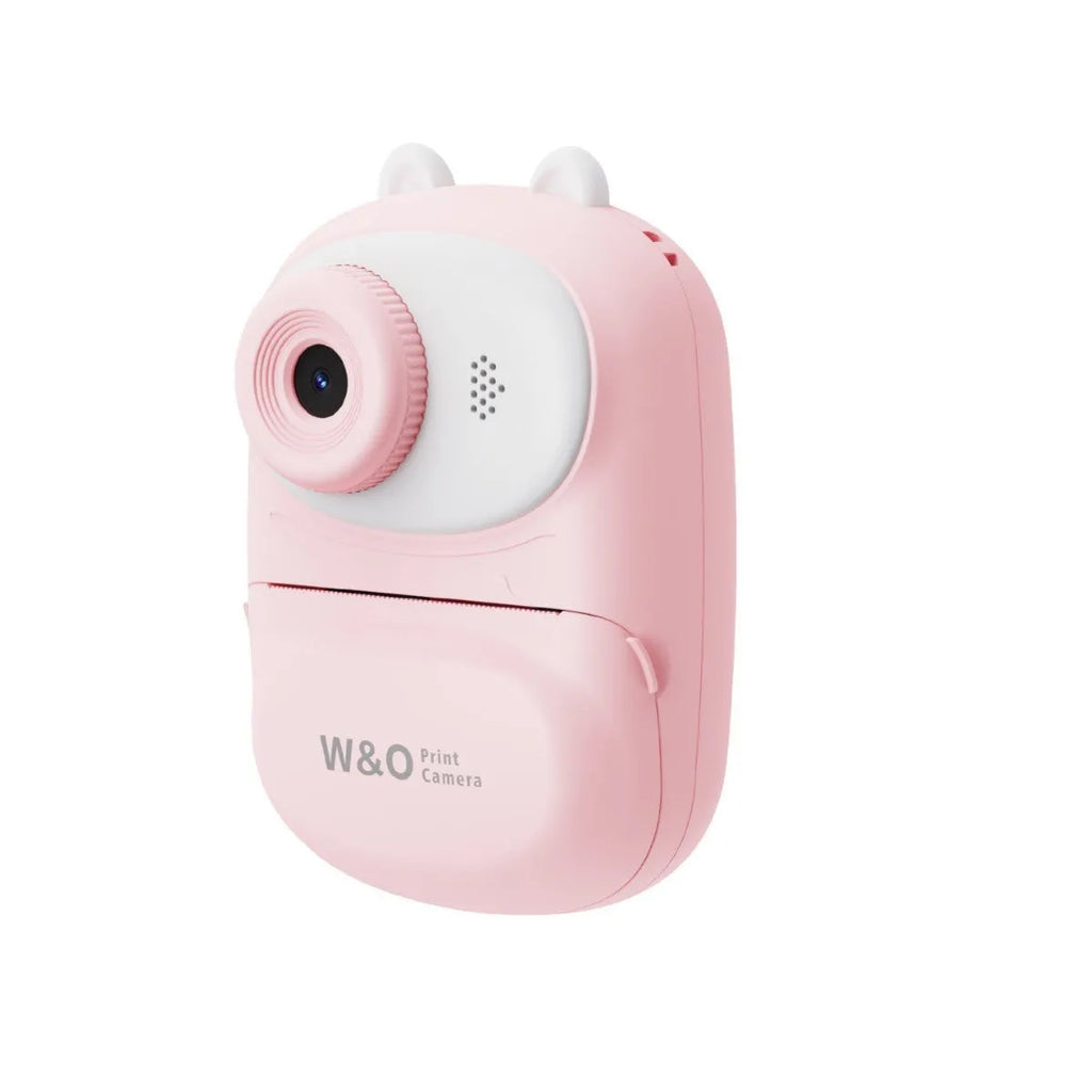 Q2 children's camera in green with polaroid instant print function, lanyard, and stickers on white background