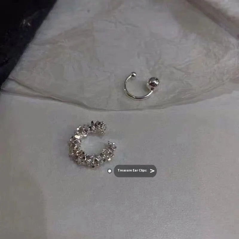 A pair of irregular geometric frosty finish ear clip earrings in colour B4710.