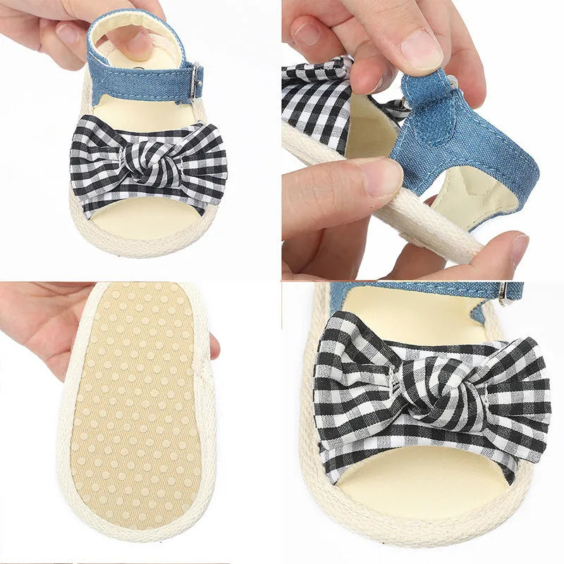 Black and white velcro fastening baby shoes for toddlers, showing low tube height design.