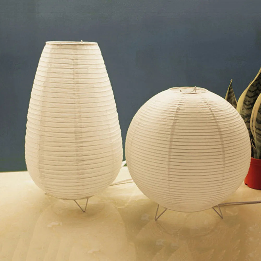 Traditional handmade rice paper table lamp with E14 bulb fitting on bedside table
