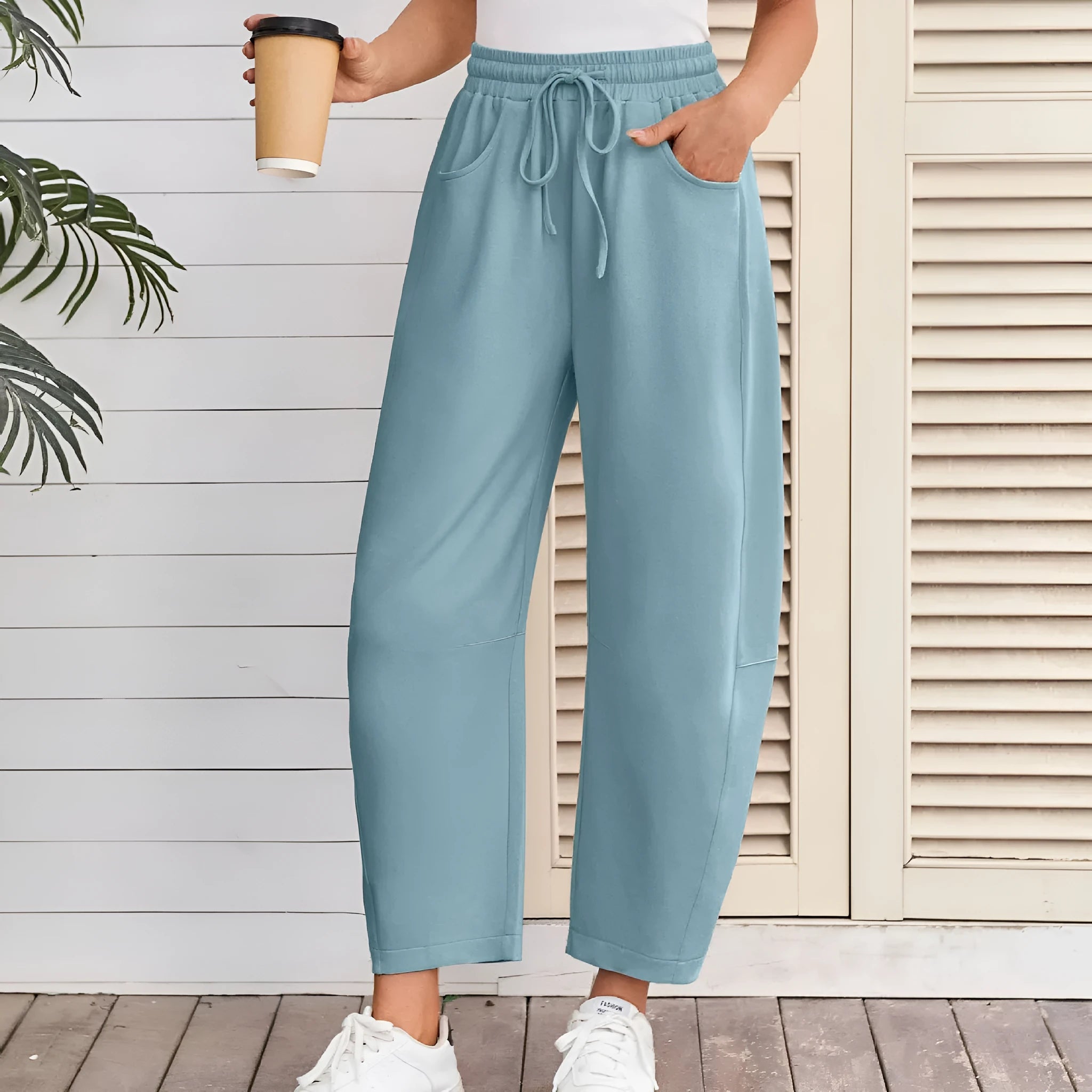 Loose cropped sweatpants with drawstring waist and side pockets in apricot colour