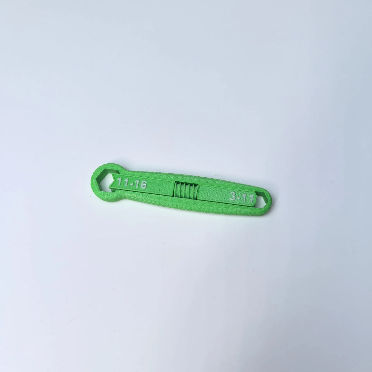 Plastic multi-function opening tool in five colours: black, gray, green, orange, yellow on white background