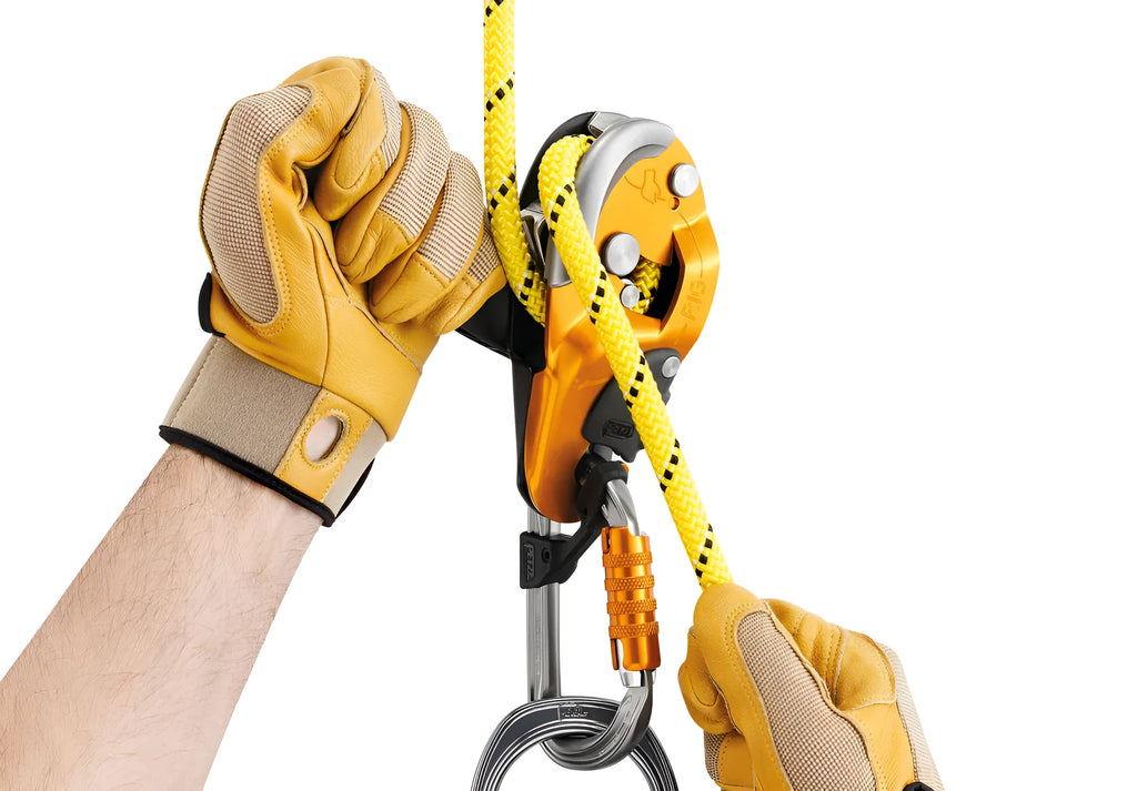 Petzl D021 RIG industrial rescue descender AUTO-LOCK black with rope installed and ergonomic handle visible