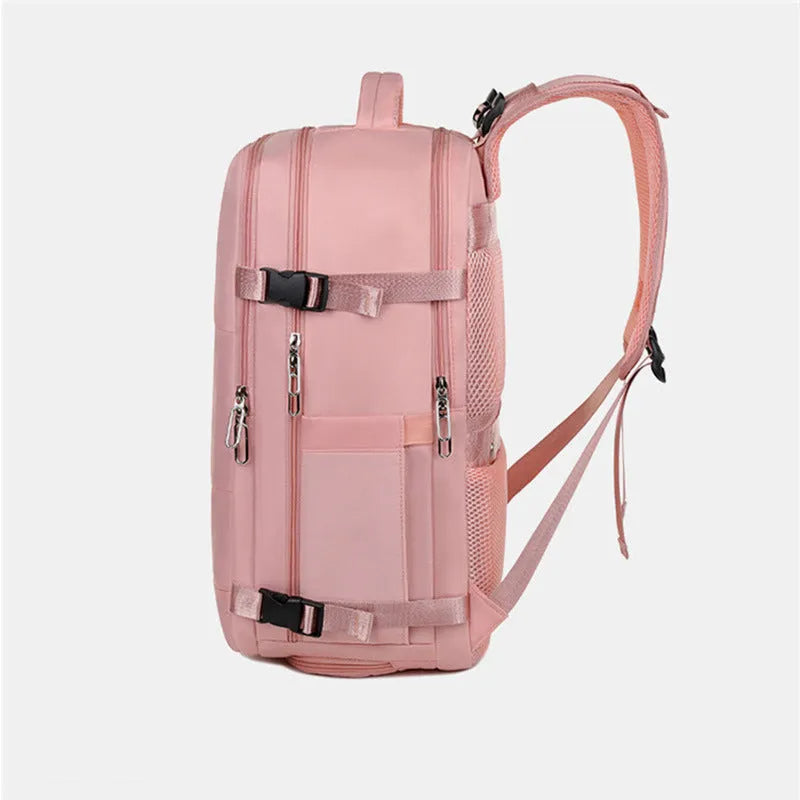Large purple travel backpack with multiple compartments open, showing laptop sleeve and organiser pockets.