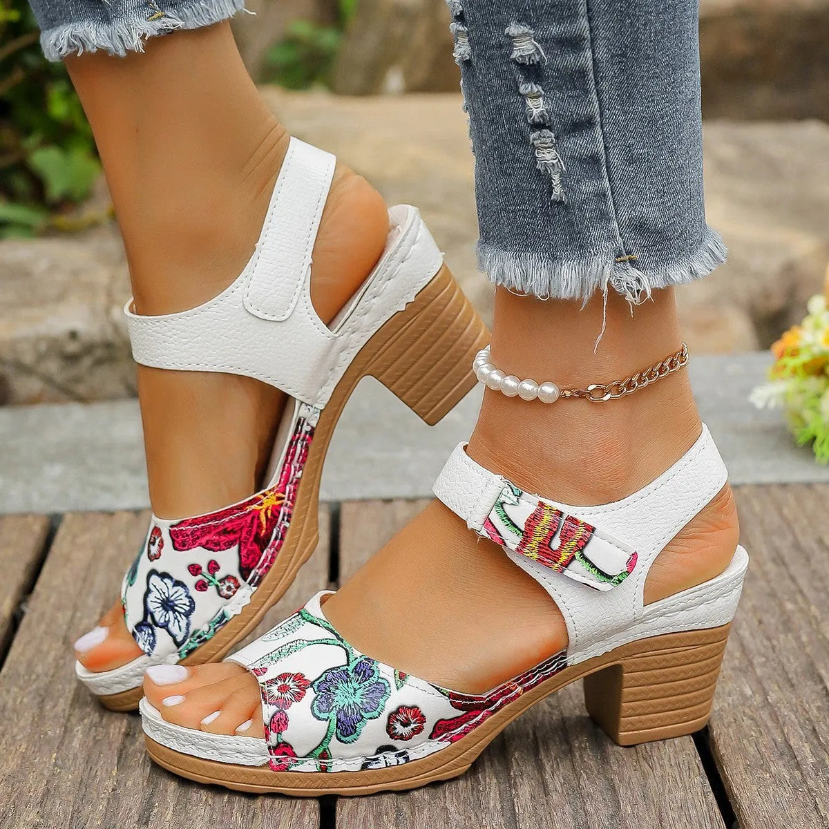 White women's high heel sandals with an adjustable Velcro strap buckle.