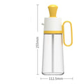 2 in 1 oil dispenser with silicone brush on wooden table against dark background