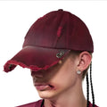Rose red cotton peaked cap with a curved peak and adjustable rear strap on a neutral background.