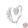 Unisex silver adjustable open ring with flying dragon wing motif on neutral background