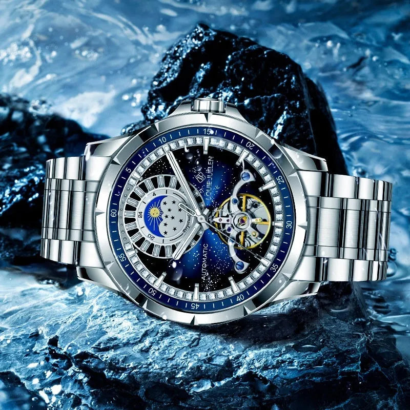 Men's silver and blue automatic waterproof mechanical watch with a stainless steel strap on a wrist