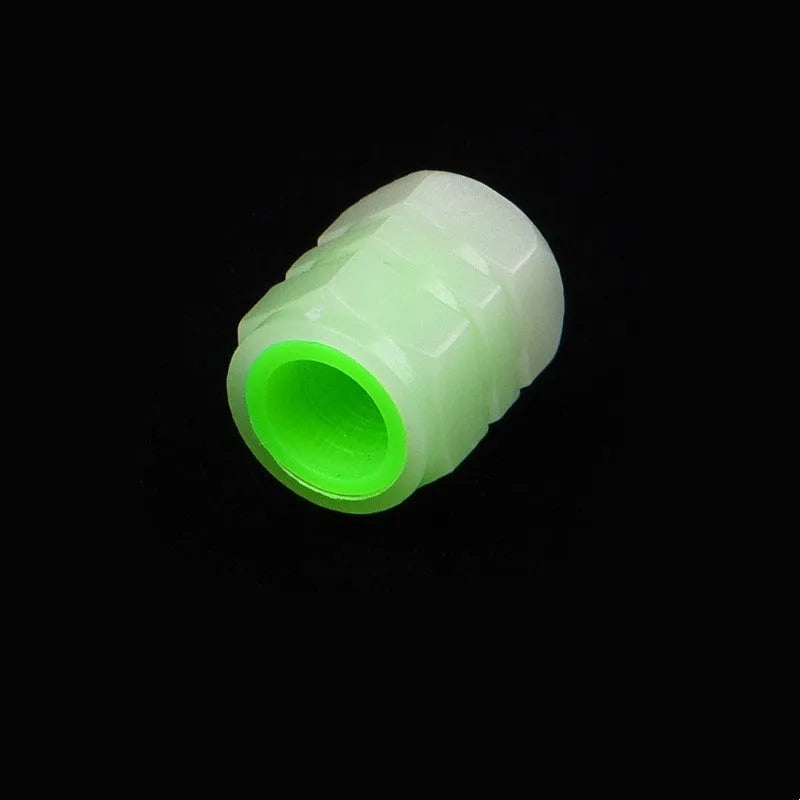 Glow-in-the-dark rubber car valve caps in 16x12mm size showing luminous property
