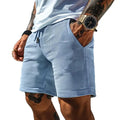 Men's light blue retro waffle knitted stretch surfing shorts with wide leg, front view