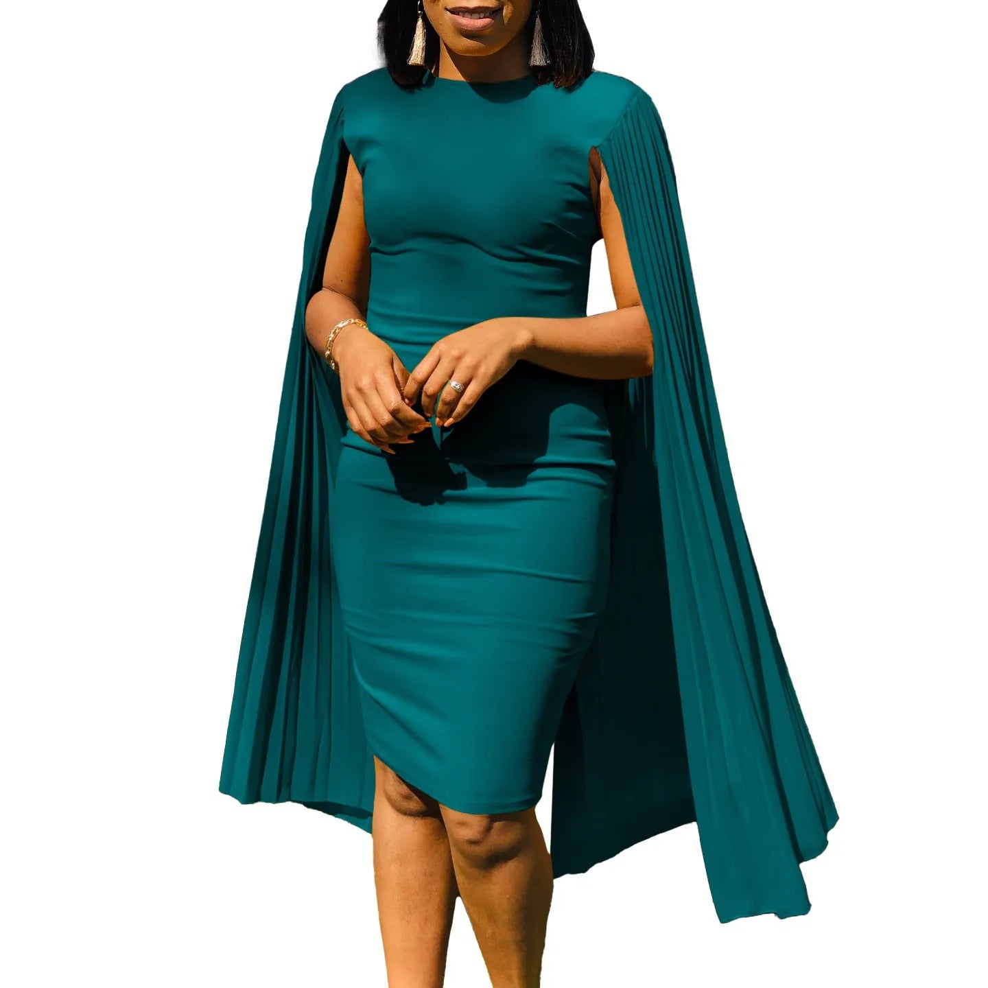 A woman wearing a long sleeve, high-waist pleated evening gown in a solid colour, showcasing the floor-length skirt and round neckline.