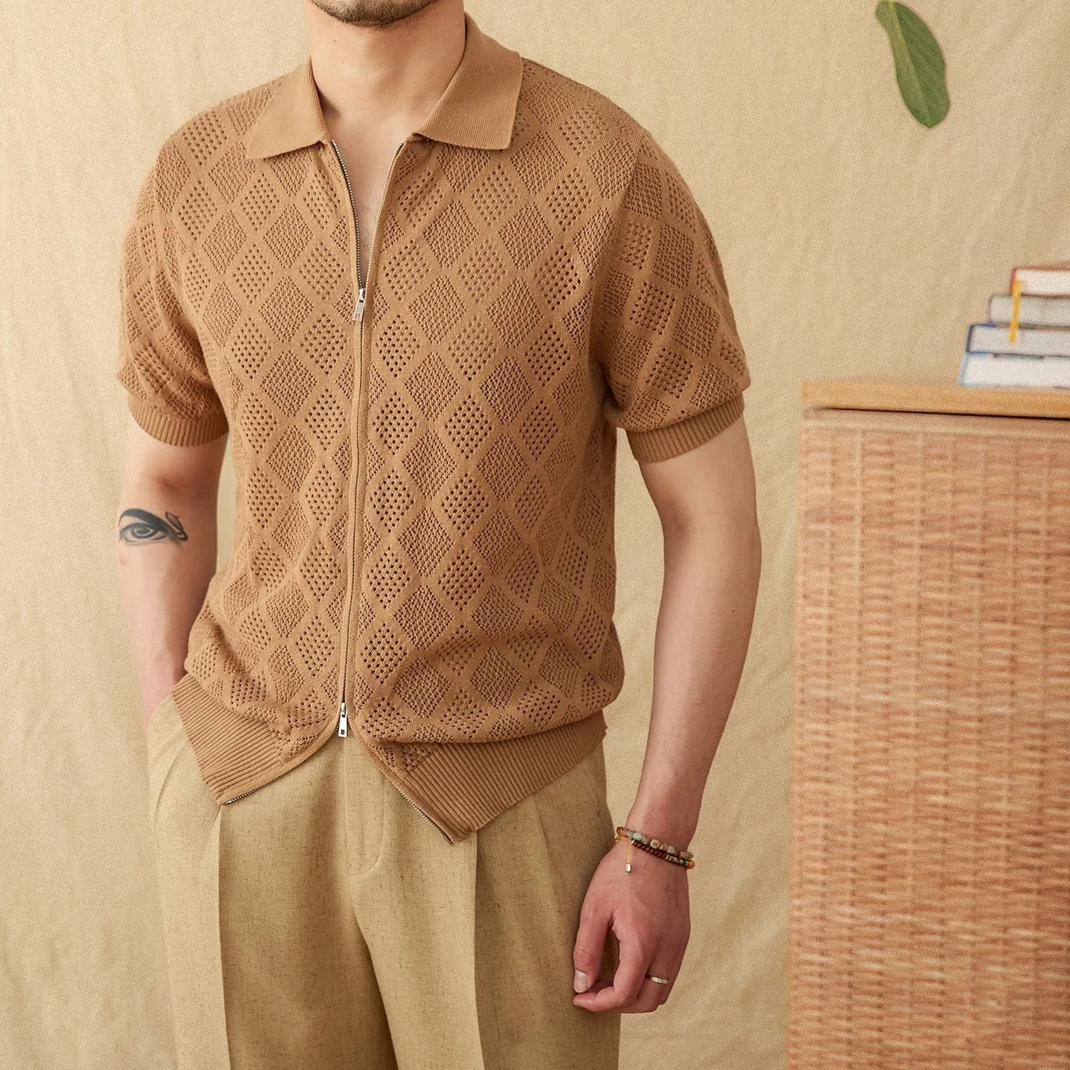 Men's light brown cotton zip-up cardigan with short sleeves and a lapel collar.