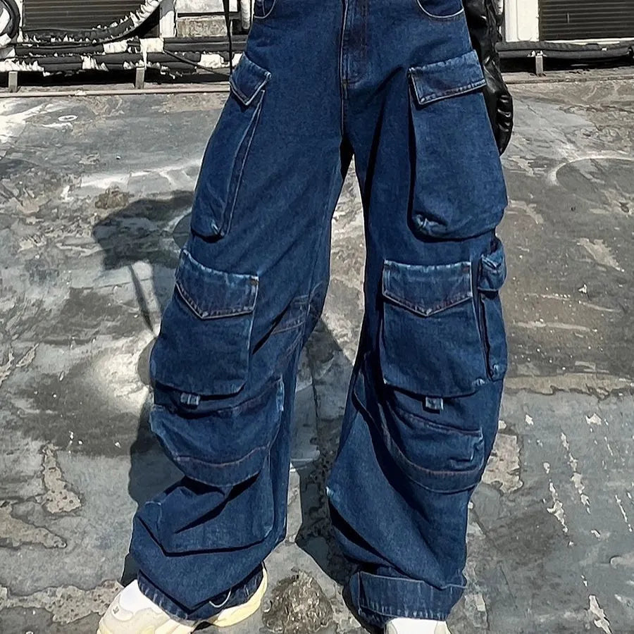 Dark blue distressed wide-leg jeans with a high waist and multiple pockets laid flat