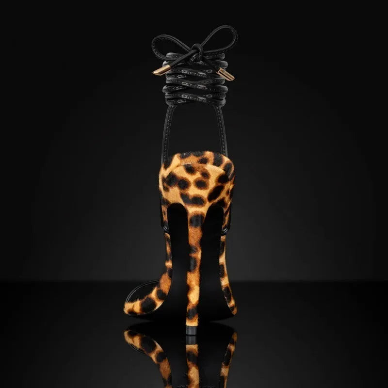 Women's leopard print Roman sandals with pointed toe and buckle fastening on a rubber sole.
