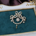 Gold court-style crown tassel brooch with micro-inlaid zircon stones in heart shape on copper base