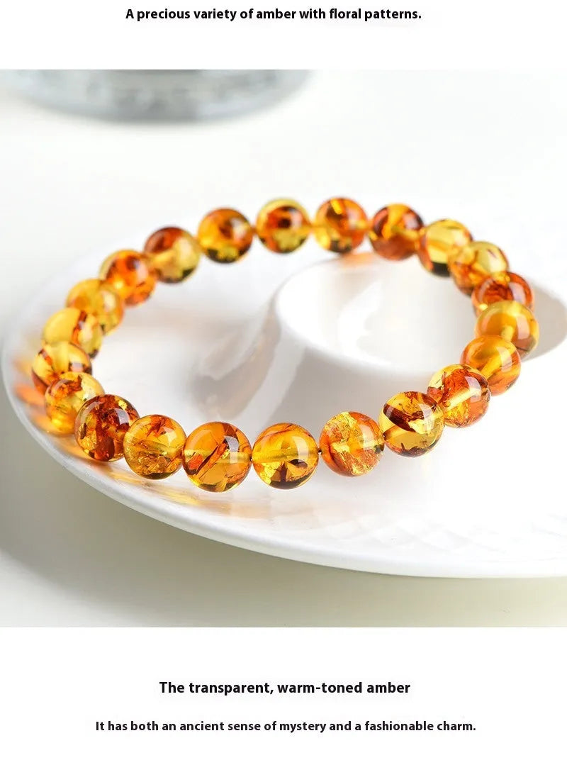Natural yellow piebald amber bracelet with flower spot patterning and geometric design