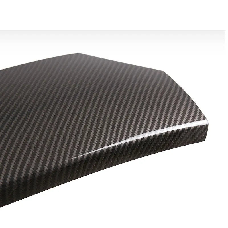 Three-piece set of glossy black ABS car armrest box covers with a carbon fibre weave pattern.
