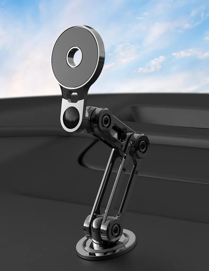 Black magnetic suction car phone holder on dashboard with mobile phone attached