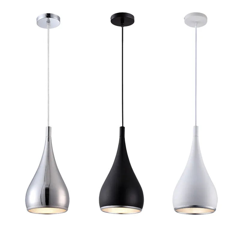 Minimalist black iron chandelier bedside lamp with three adjustable heads on a long platter.