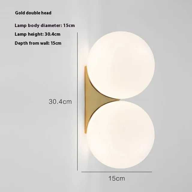 Simple glass ball wall lamp with gold finish and iron frame for bedroom bedside