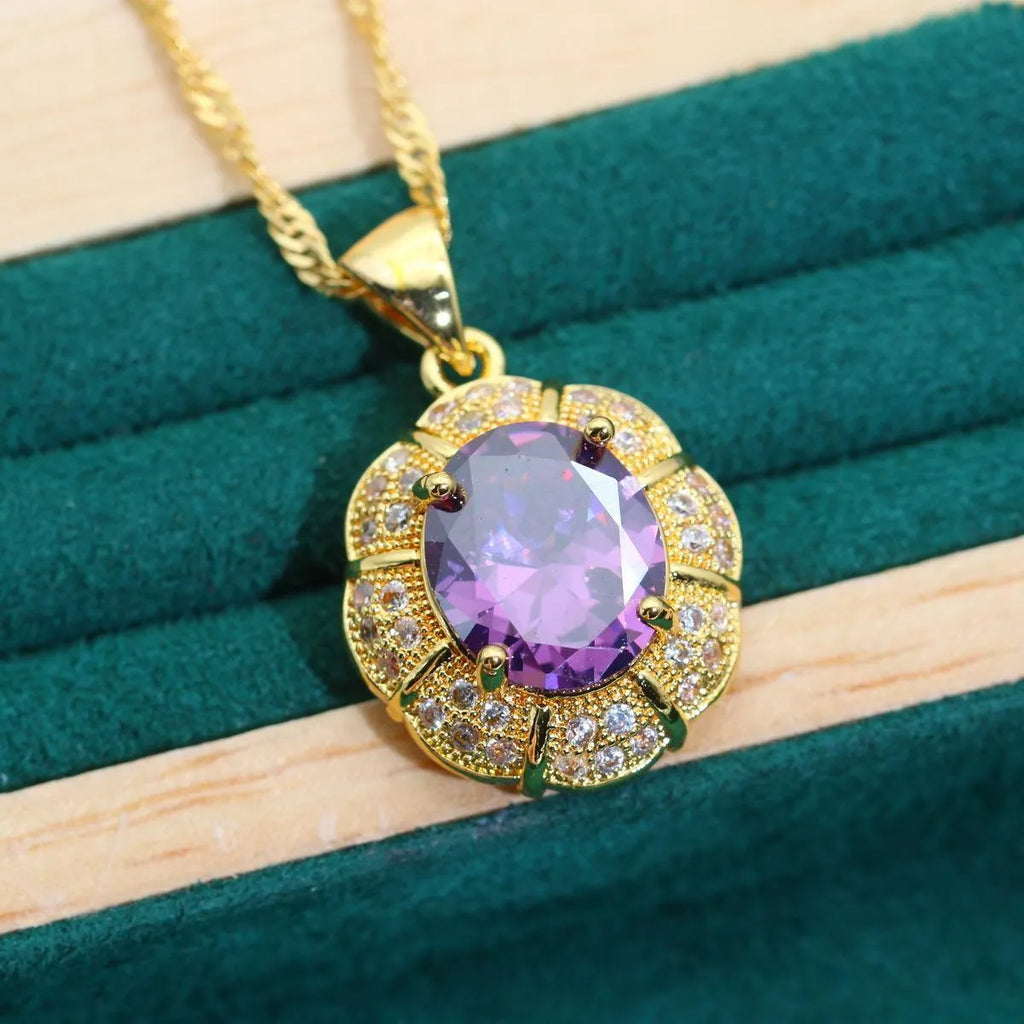Gold-plated jewellery set with multi-colour zircon stones including necklace, earrings, ring, and bracelet.