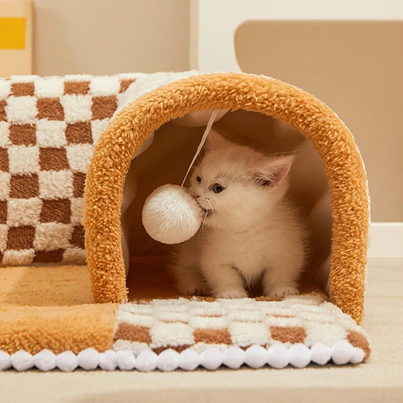Fan-shaped plush pet bed for dogs and cats with a central tunnel, shown in a yellow colour.