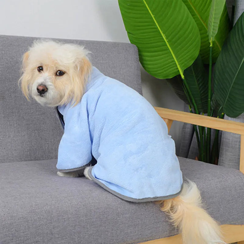 Blue microfiber pet drying towel bathrobe for dogs and cats on a light background
