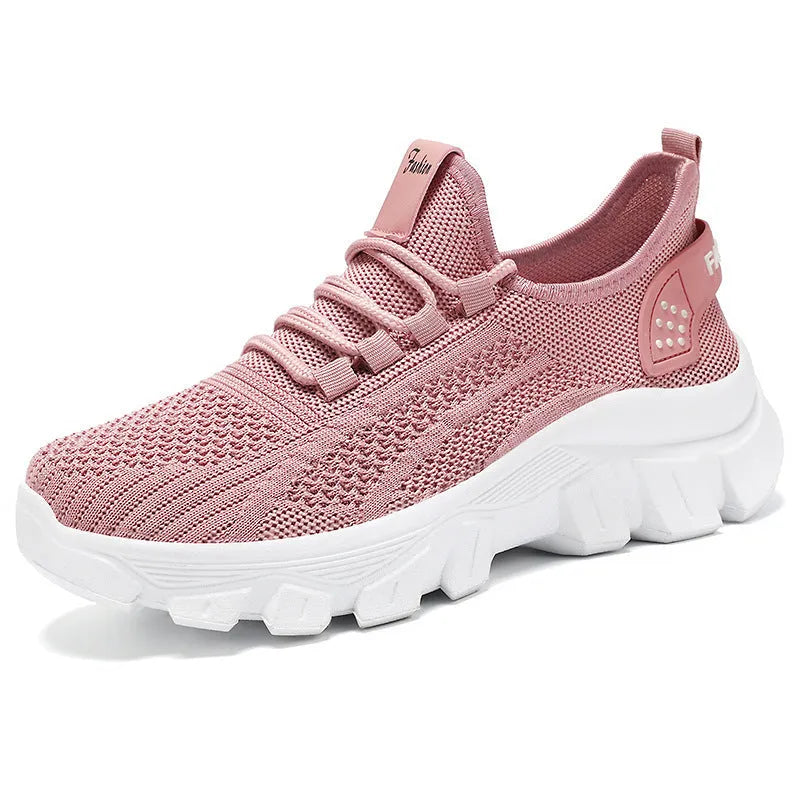 Women's Flyknit sneakers with thick PVC sole in beige colour showing lace-up front and round toe design