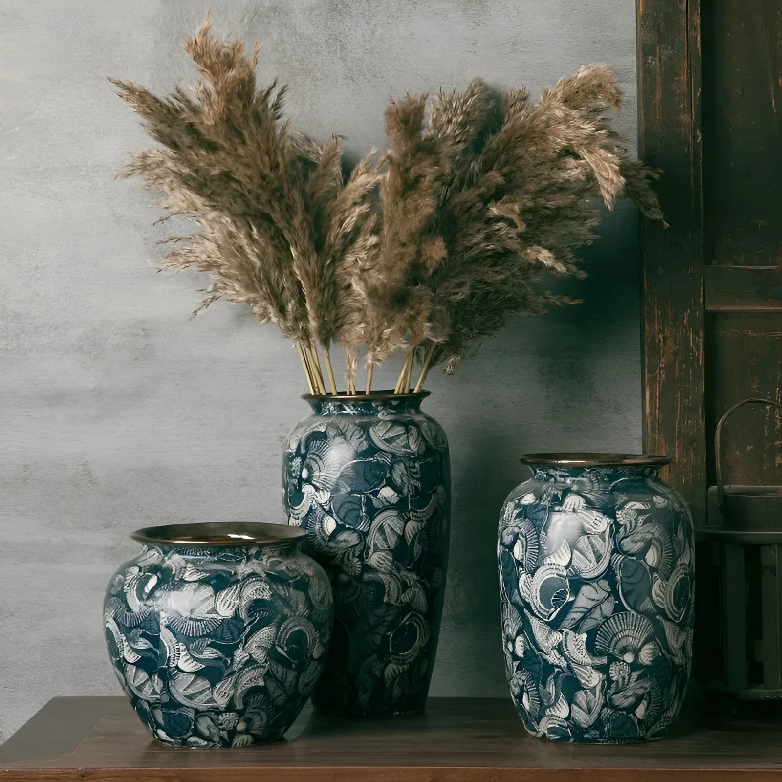New Chinese retro artistic ceramic vase with dried flowers on a tabletop in a home living room setting