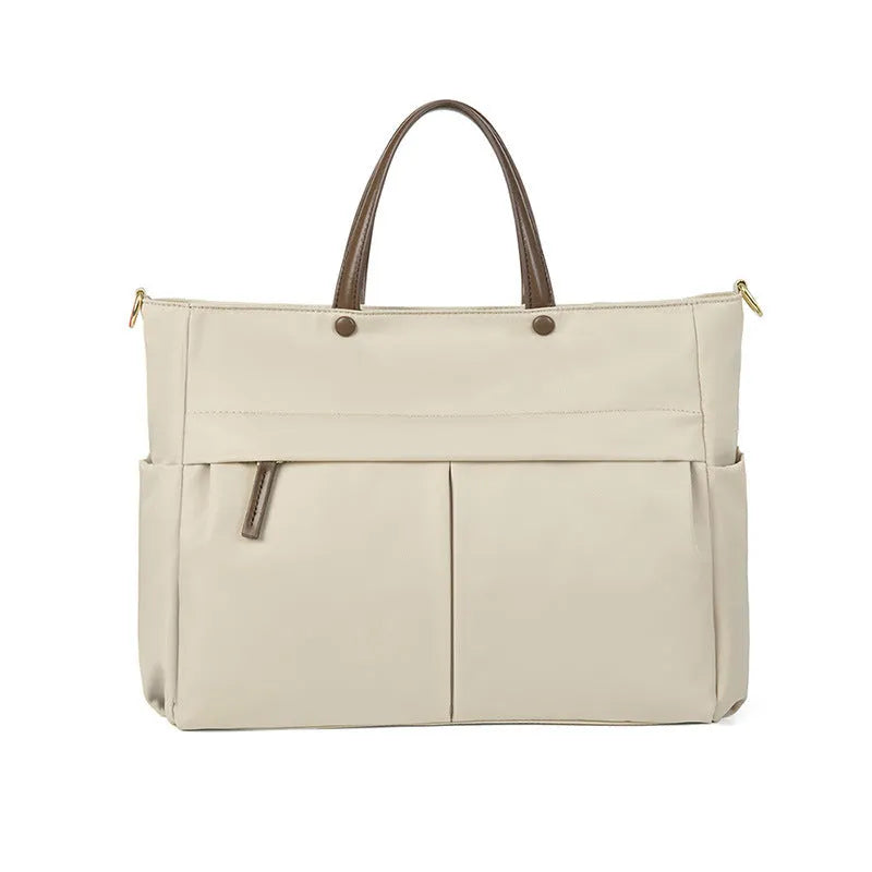 Women's oxford cloth portable briefcase in nuts and apricots colour with contrast stitching.