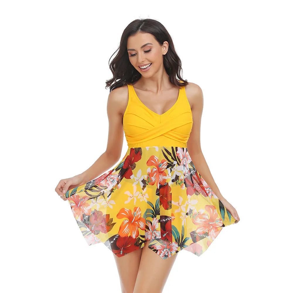 Women's one-piece swimsuit with an attached black tulle skirt, showing the split design.