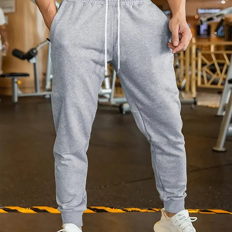 Men's polyester linen leisure trousers with drawstring waist and elasticated calf in loose fit design