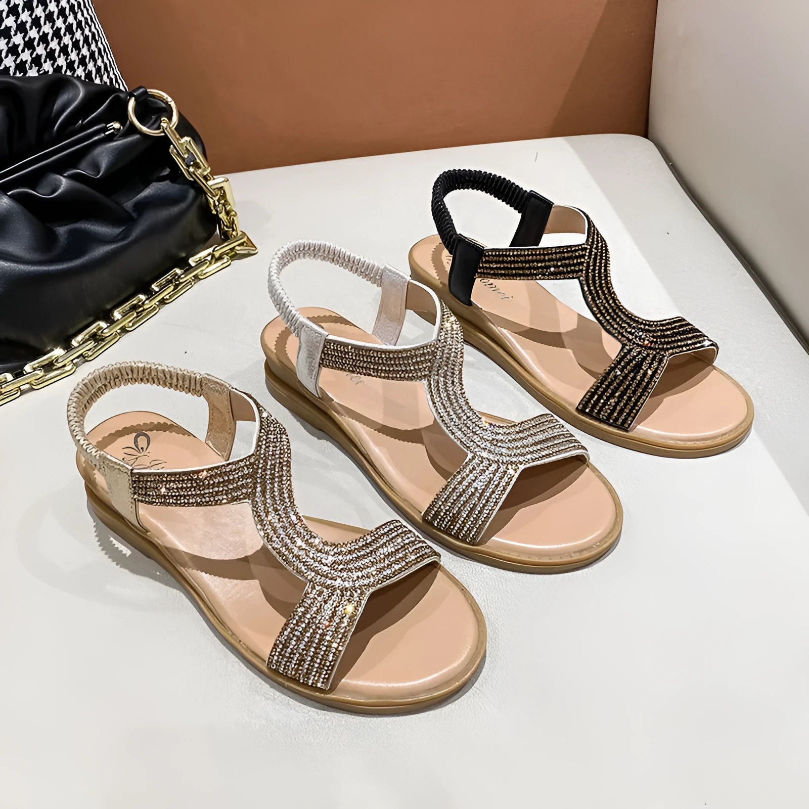 Women's gold patent leather beach sandals with rhinestone decoration and a non-slip sole.