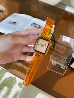 Brown transparent silicone replacement strap for Apple Watch, showing connector for compatible models.