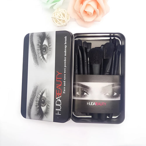 12 black makeup brushes in a tin box with nylon bristles and wooden handles on a white background