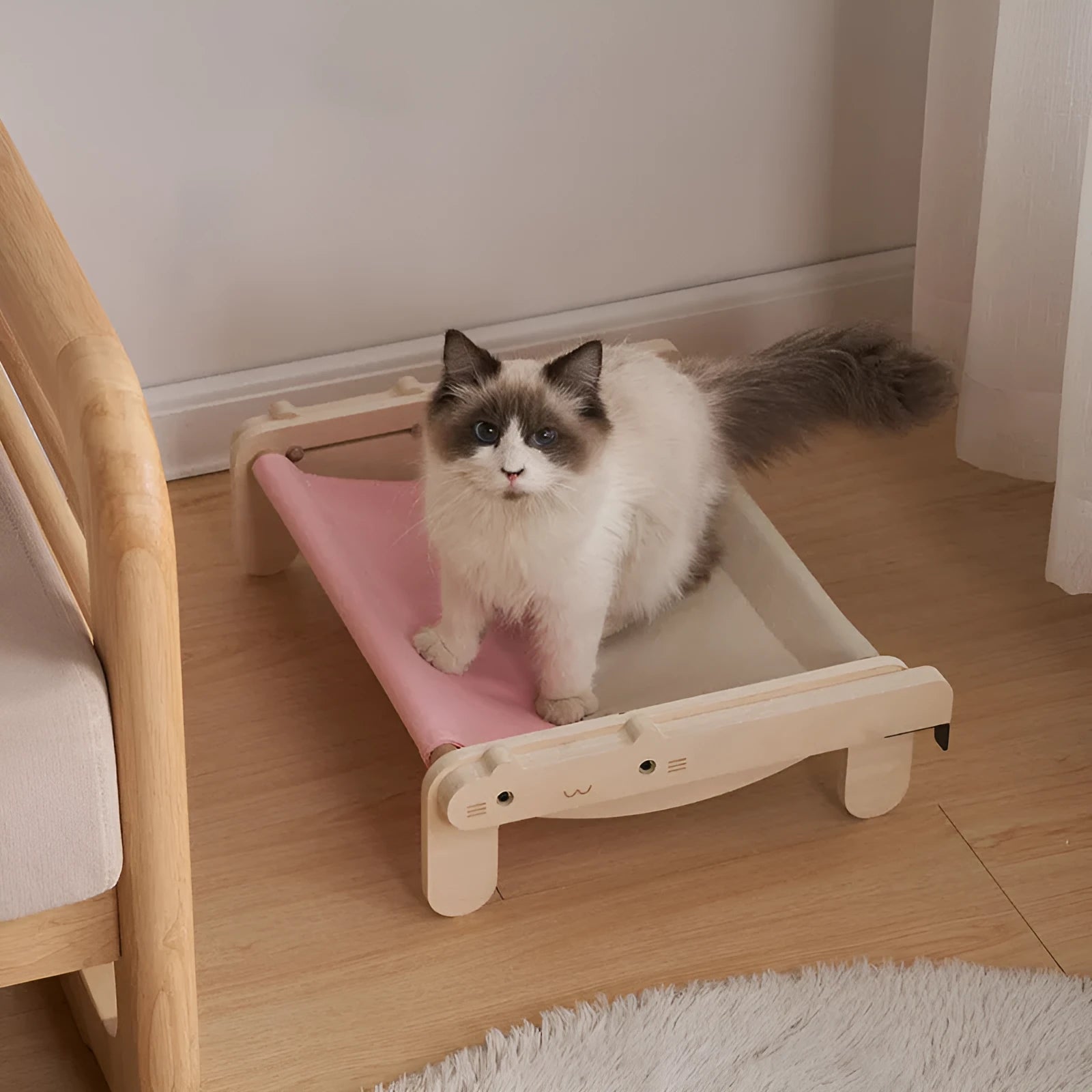Solid wood cat bed with removable cushion in grey-toned seasonal pattern colours