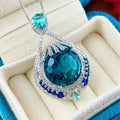 Women's blue crystal geometric necklace with fireworks-cut pendant on water wave chain