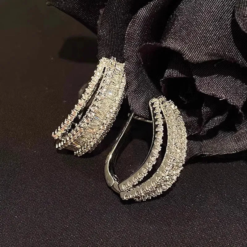 Women's geometric copper stud earrings with white gold plating and small zircon stones