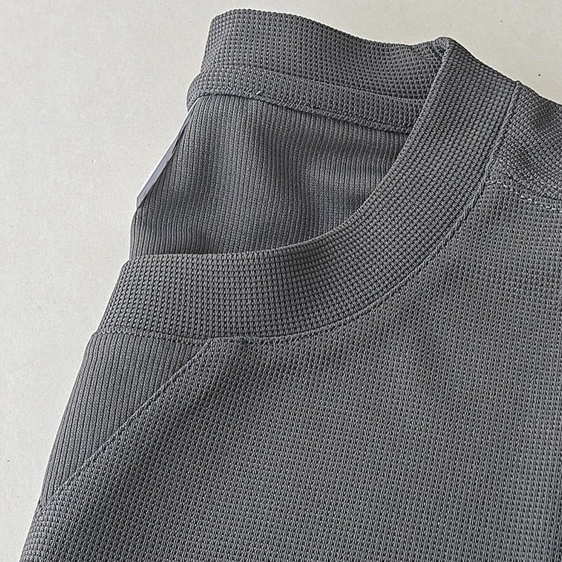 Men's dark grey heavy waffle texture short sleeve t-shirt on a hanger