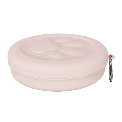 Collapsible silicone dog feeding bowl with lid shown in a green colour.