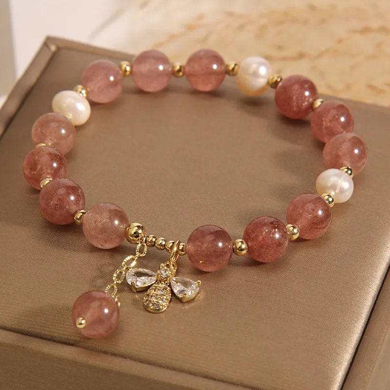 Women's bracelet with strawberry quartz stones, freshwater pearls, and zircon on an alloy chain.