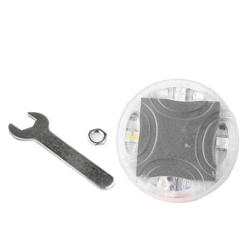 Colourful solar-powered LED hub decorative light for vehicle wheels, shown with installation screws.