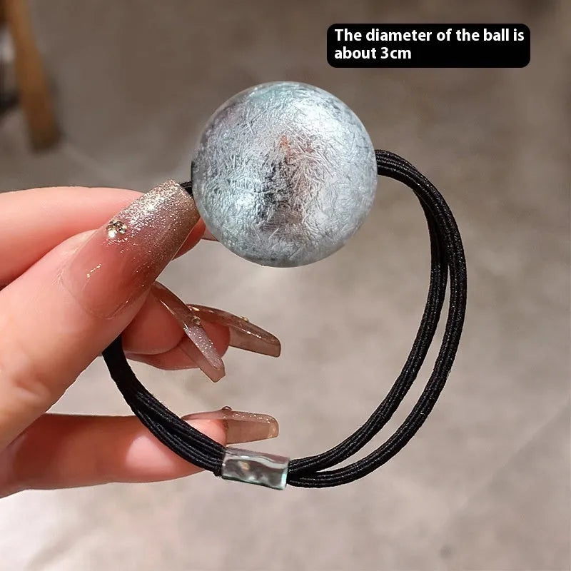 Resin hair band headdress with electroplated gold finish, round head rope style on a white background
