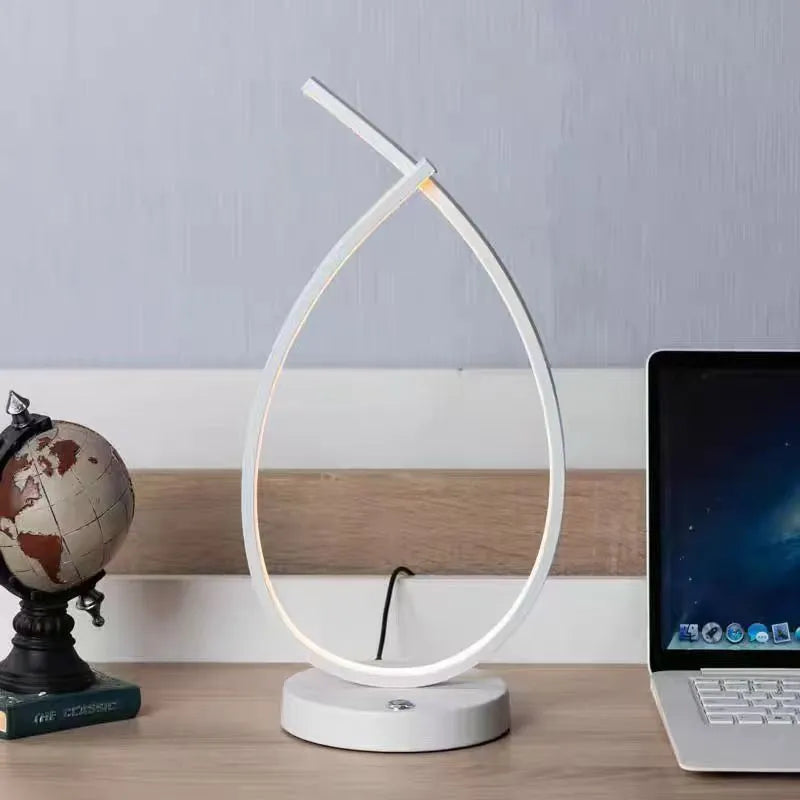 Water drop shaped table lamp in black or white with warm light and USB power