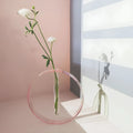 Handmade acrylic test tube vase with polished surface, shown in pink or transparent, small or large size options.