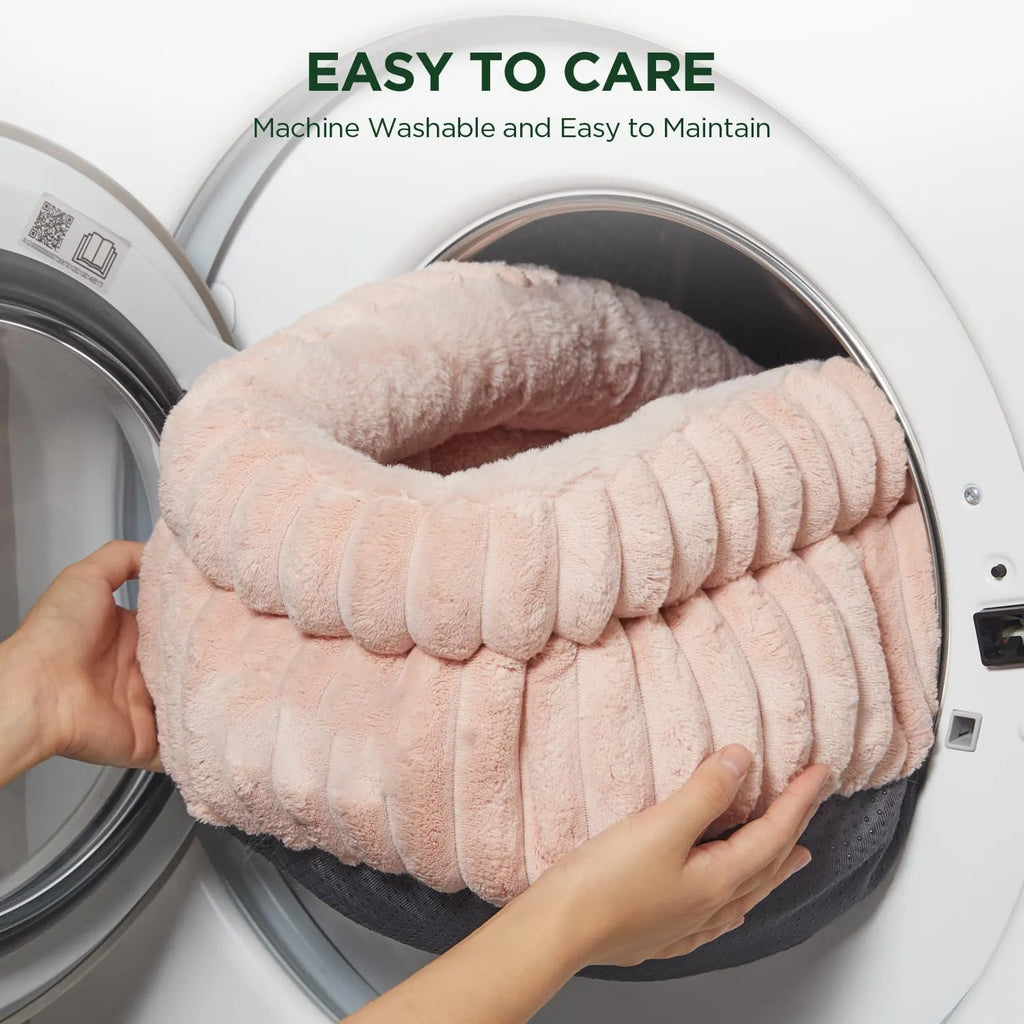 Washable round cat bed in beige with super soft plush faux fur and anti-slip bottom